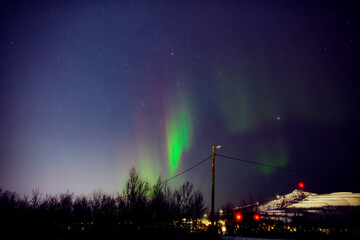 Aurora borealis, polar lights with Milky Way stars.
