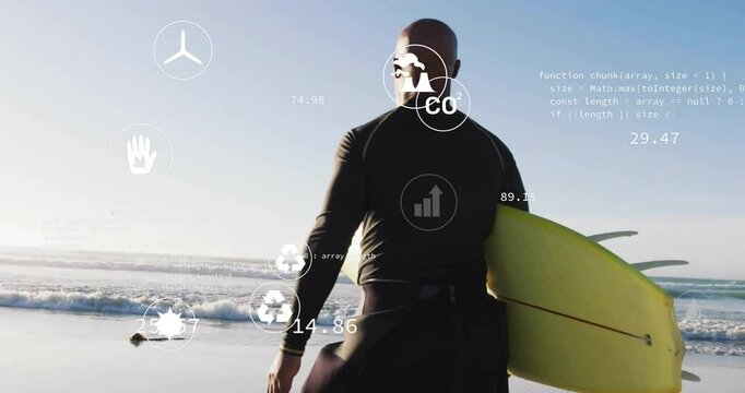 Surfer man standing on sandy shoreline gathering tech data through floating charts and code