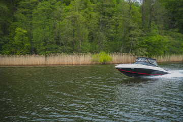 A motorboat speeding on a lake in Masuria.