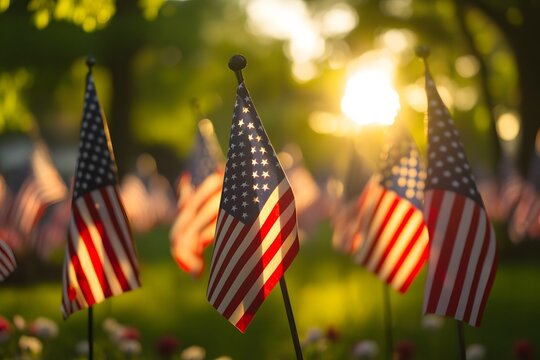 American flags with sunlight and bokeh illustrating patriotism and memorial day