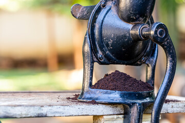 Ground coffee in the manual grinder
