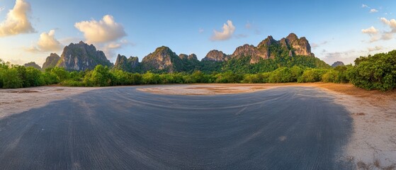 Panoramic view of Khao Sam Roi Yot mountains and road in Thailand at sunset; wide angle landscape shot of nature park