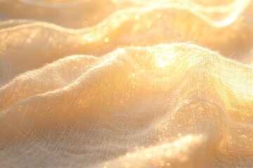 Fototapeta premium Soft, light beige fabric draped in golden sunlight.