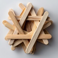 Intricate Wooden Craft A CloseUp of Interwoven Popsicle Sticks isolated on white Background