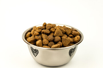 A bowl of cat or dog food on a white background. Pet food. Balanced food