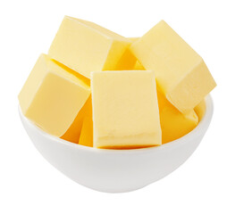 Butter cubes in a bowl isolated on white background. Fresh cow’s milk butter pieces close up. Cooking Package design element..