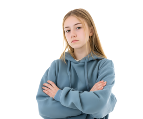 A young woman with long blonde hair and a blue hoodie poses with confidence.