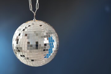 Shiny disco ball on blue gradient background. Space for text