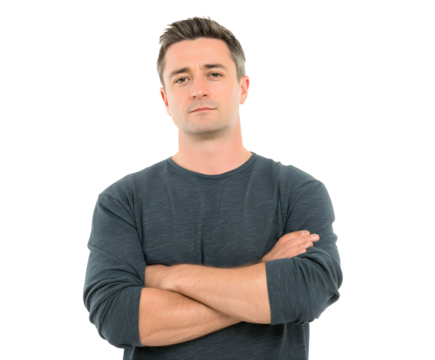 A man in a grey long-sleeve shirt stands with arms crossed, looking straight ahead.