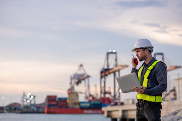 Industrial engineer workers operations marine port cranes loading and unloading of cargo ships...