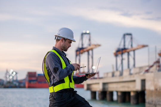 Industrial engineer workers operations marine port cranes loading and unloading of cargo ships global trade and supply chain import export environment monitoring responsible global economy.