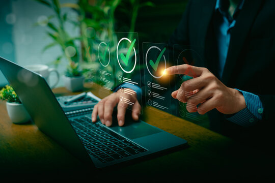Business Professional Evaluating Checklists on Laptop with Futuristic Virtual Interface, Highlighting Quality Assurance, Decision-Making, Task Management, Project Planning, Successful Goal Completion