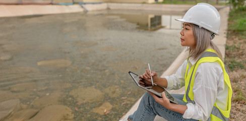 Environmental engineers work at wastewater treatment plants,Water supply engineering working at...