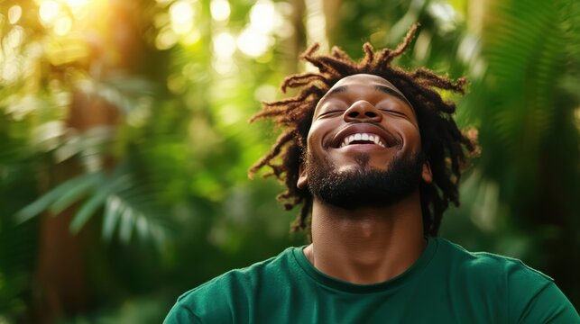 A radiant man laughs heartily in a lush green forest, capturing a moment of sheer joy and connection with nature, symbolizing exuberance and vitality.