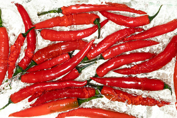 Floating Chili Peppers in Transparent Still Water