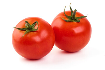 Ripe fresh tomatoes, close-up, isolated on white background.