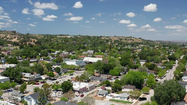 Aerial drone view of Paso Robles California suburb - homes, trees, hills 01