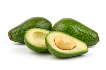 Fresh green avocados, whole and halved with seed, isolated on white background.