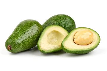 Fresh green avocados, whole and halved with seed, isolated on white background.