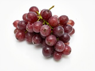 Fototapeta premium Fresh Red Grapes Clustered on White Background