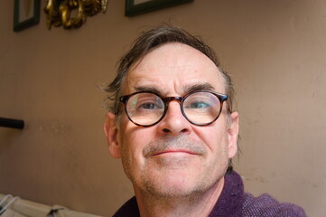 senior man with glasses smiling