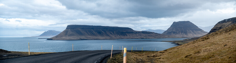 High resolution panoramic view of mountains including Kirkjulfell mountain with road 54 in the foreground on the Snæfellsnes peninsula in Western Iceland.
