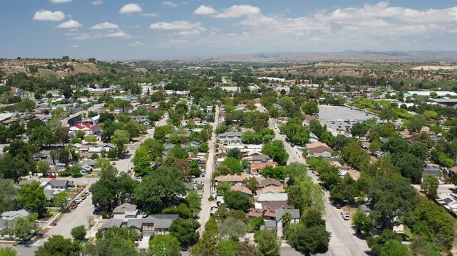 Aerial drone view of Paso Robles California suburb - homes, trees, hills 03
