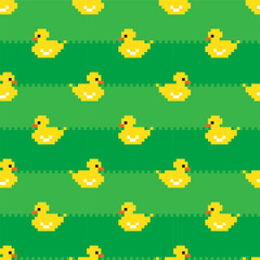 Cute yellow pixel ducklings on green grass background. Seamless pattern, print, vector illustration