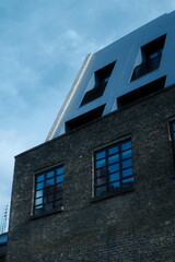 A highly detailed photo of the building is made of brick with artistic lighting. weather: . mood: moody and dramatic.