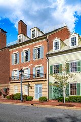 Fototapeta premium street with modern brick townhouses lining the road.