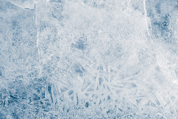 Ice texture crystal, blue tones background. Textured, cold, frosty surface of ice. with cracks