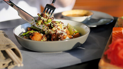 A Delicious Quinoa Bowl Filled with Fresh Vegetables and Topped with a Flavorful Sauce
