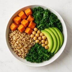 Vegan Buddha bowl with quinoa and vegetables in round white bowl

