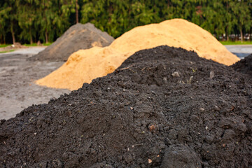 Soil and rice stalks for cultivation. Top view of fertile soil in the garden. Background texture.