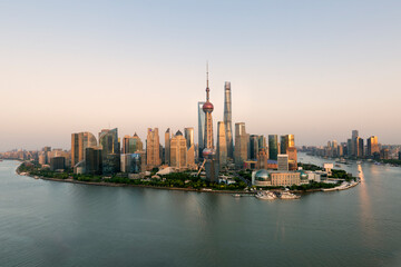  Aerial view of shanghai skyline and winding river at sunrise.