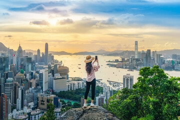 Tourist take a photo on viewpoint in Hong Kong.
