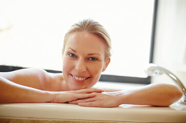 Home, happy and portrait of woman in bath with soap, bubbles and foam for cleaning, washing and...
