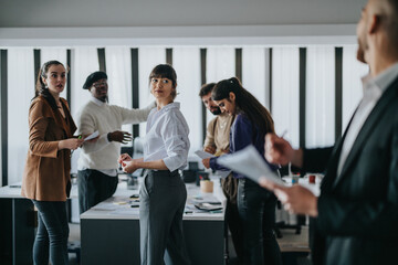 Diverse group of professionals collaborating and engaging in a business meeting within a modern...