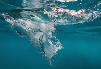 Fototapeta premium Crystal-clear ocean wave splashing under a bright summer sun, capturing the beauty and motion of sea water in a vibrant tropical coastal scene.