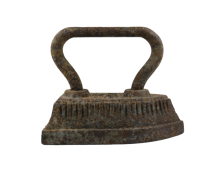 This cast iron iron dates back to the last century, highlighting the intricate design and durability of antique household tools used for ironing clothing before the invention of modern appliances.