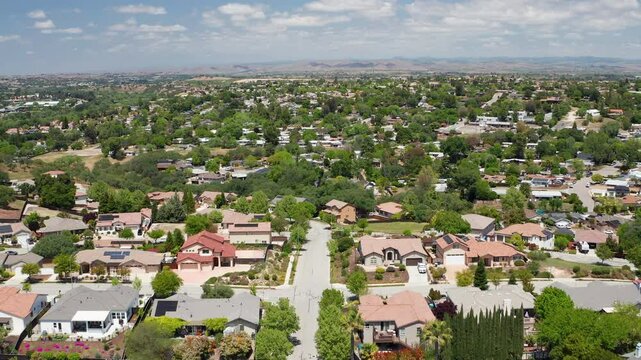 Aerial drone view of Paso Robles California suburb - homes, trees, hills 09