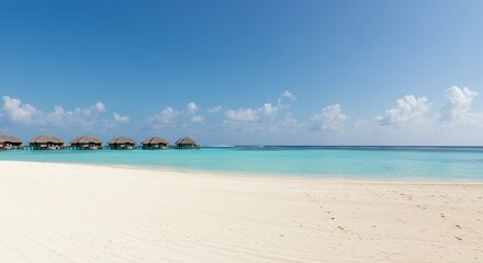 Fototapeta premium Picturesque Tropical Beach with Turquoise Water and Bungalows Under Clear Blue Sky Panorama in Maldives Exotic Summer Landscape