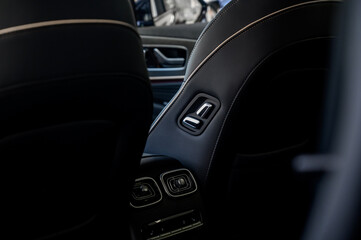 Close-up of modern car seat adjustment buttons