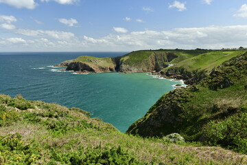 Plemont Bay, Jersey, U.K. Beautiful natural beach in Springtime and high tide.