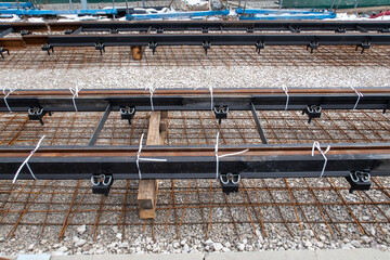 close-up of railway tracks being constructed or repaired