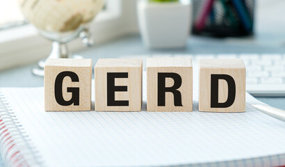 The word GERD is written in blocks on a piece of paper