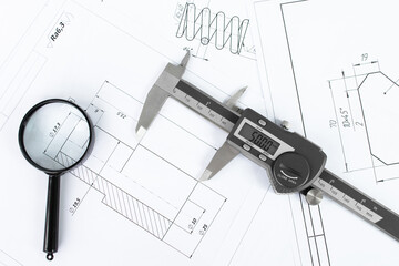 Blueprints and tools. Caliper and Blueprint Measuring Precision in Engineering