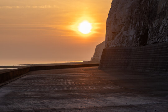 Looking west towards the sunset, on the undercliff path at Peacehaven on the Sussex coast