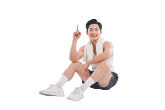Portrait of muscular Asian man in sportswear sitting posing on white background	
