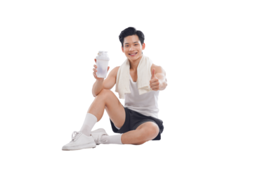 Portrait of muscular Asian man in sportswear sitting posing on white background